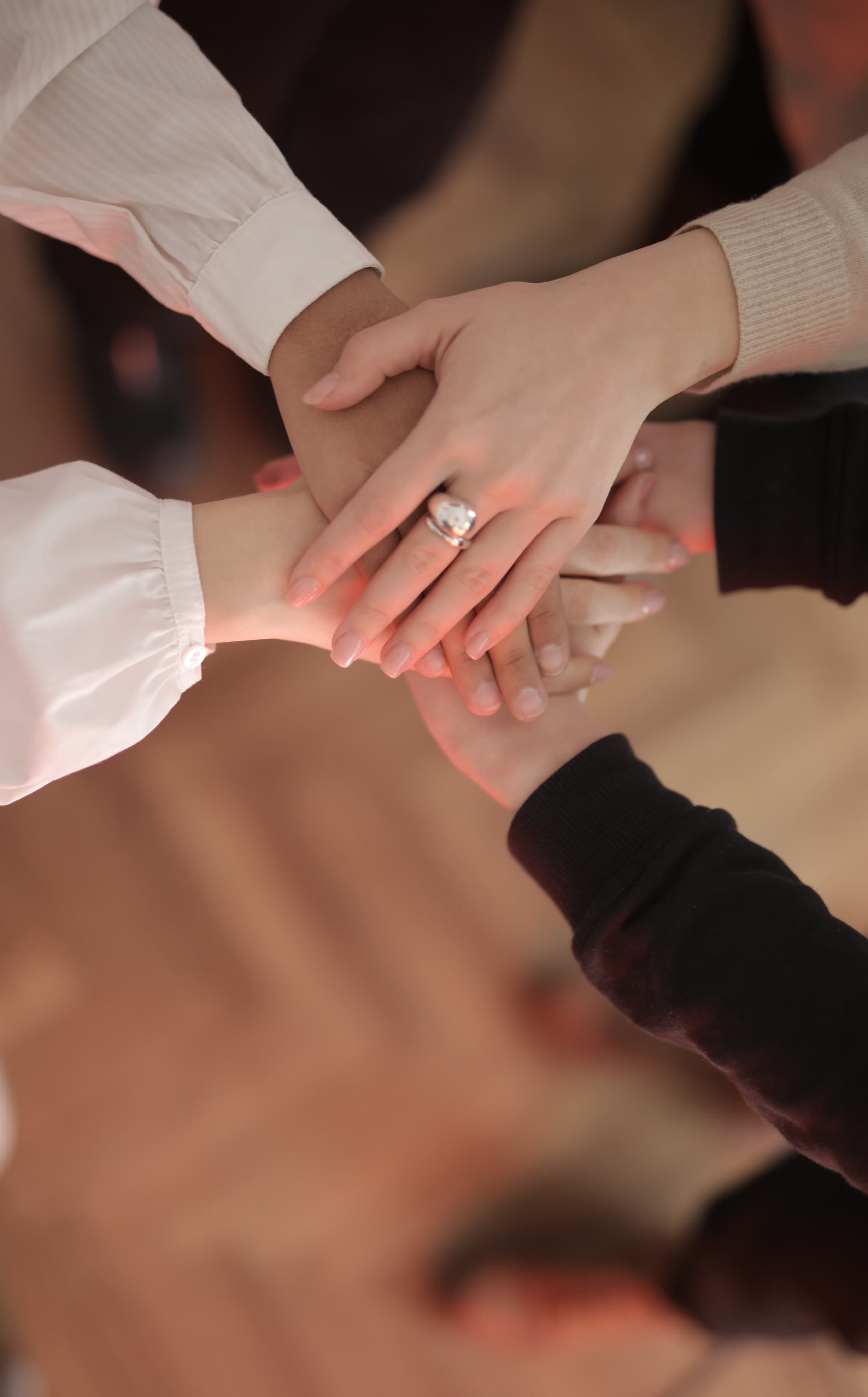 Photo of joined hands showing unity